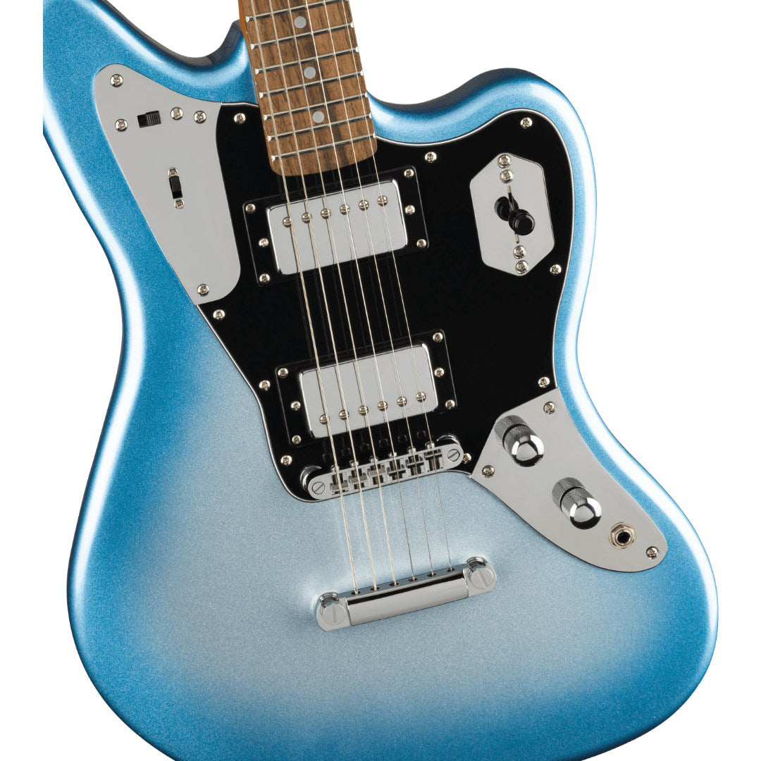 Blue electric guitar on a white background