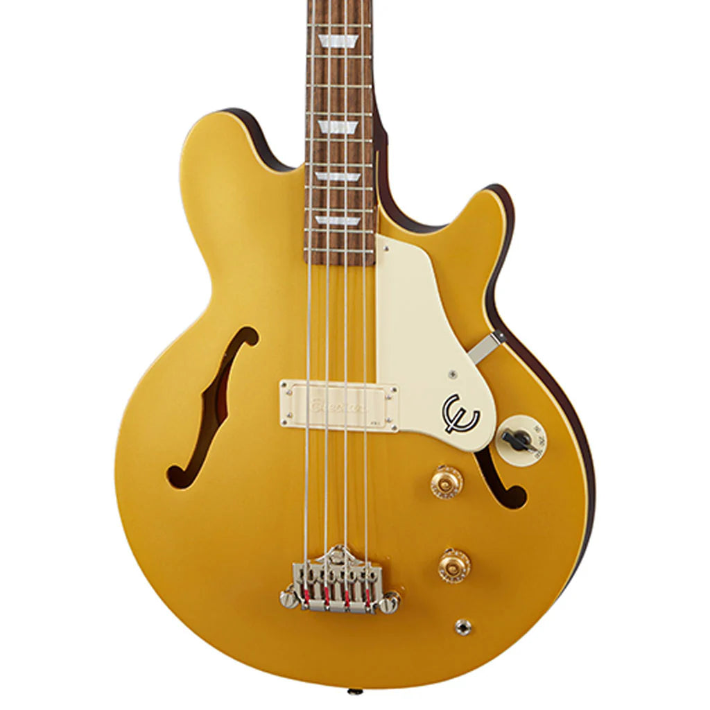 Gold electric guitar with a white pickguard on a white background