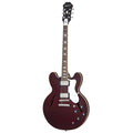 Electric guitar with a maroon body on a white background
