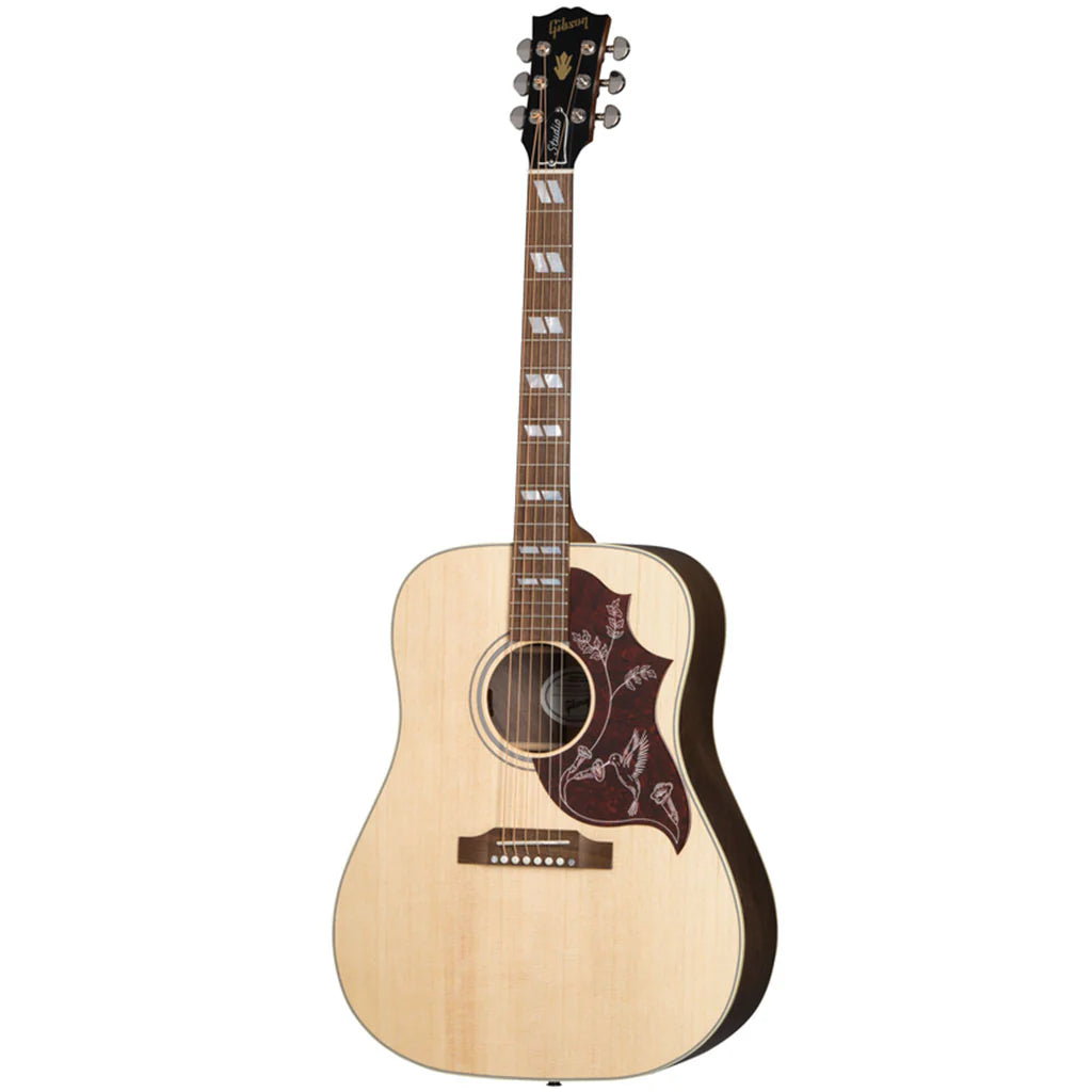 Acoustic guitar with a natural wood finish on a white background