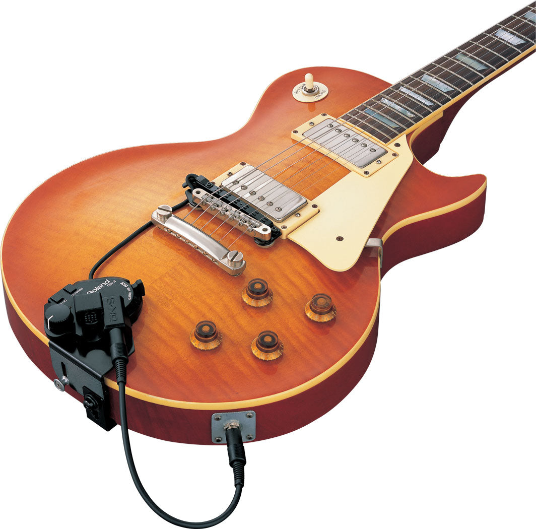 Electric guitar with a cable attached on a white background